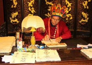 Photo of a Chinese shaman doing calligraphy