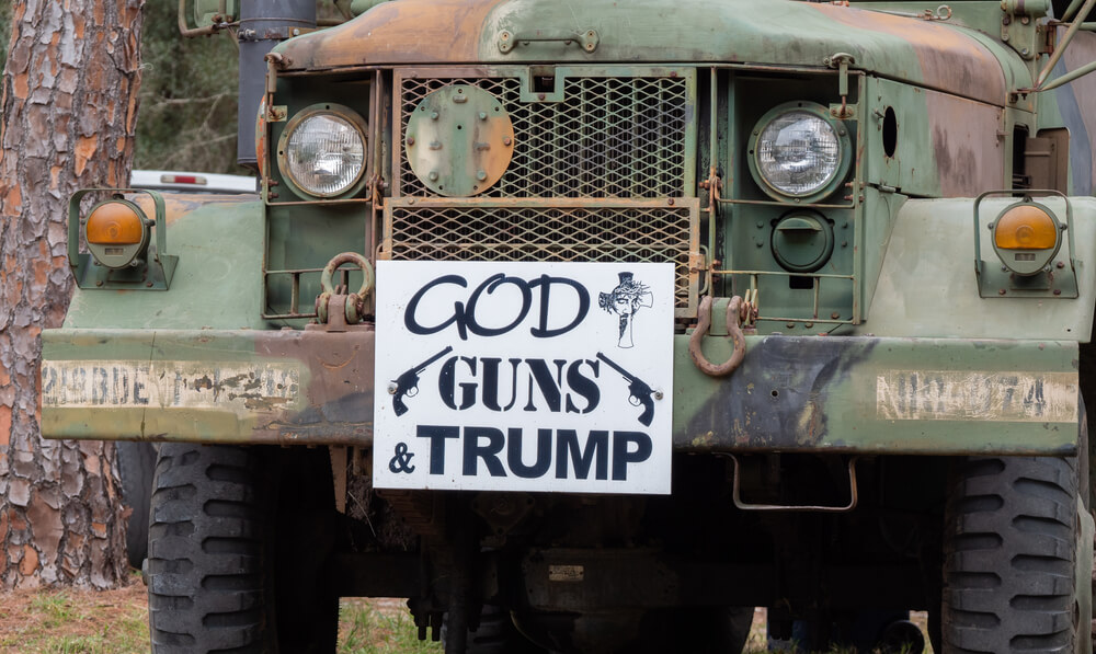 A Vehicle with Guns Images and Text, Gods, Guns and Trump